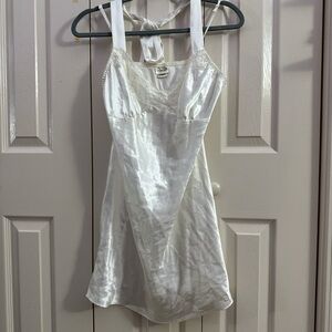White lingerie nightgown with lace and bow details